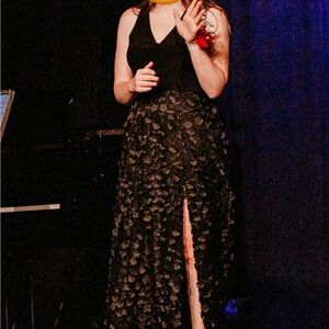 XSCAPE black and flower-petal covered gown with slit on left side. Size 6